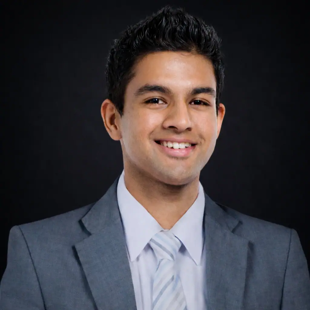 Professional business portrait of a RealSky Group real estate agent on a dark background